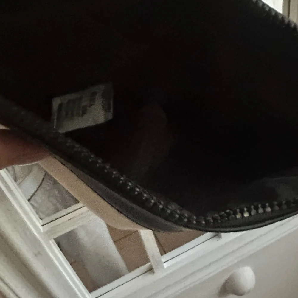 Black and Cream woman YSL beaute  Bag